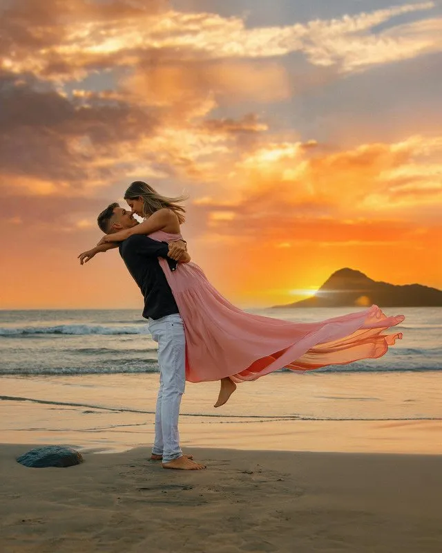 A couple embracing on the beach at sunset